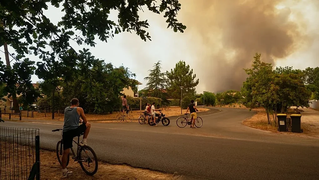 Europe wildfires evacuations response includes water bomber aircraft like this one battling flames from the air
