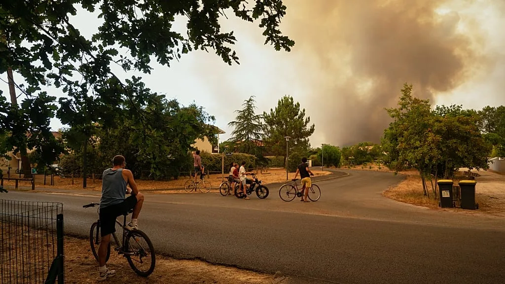 Europe wildfires evacuations response includes water bomber aircraft like this one battling flames from the air