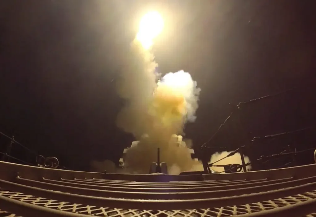 US strikes on Iran shown as a projectile launched over the Gulf toward Iranian military targets