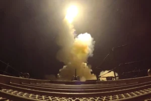 US strikes on Iran shown as a projectile launched over the Gulf toward Iranian military targets