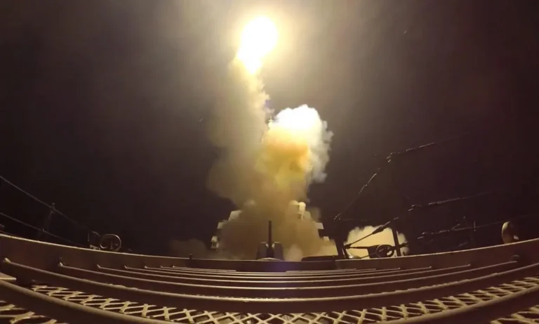 US strikes on Iran shown as a projectile launched over the Gulf toward Iranian military targets