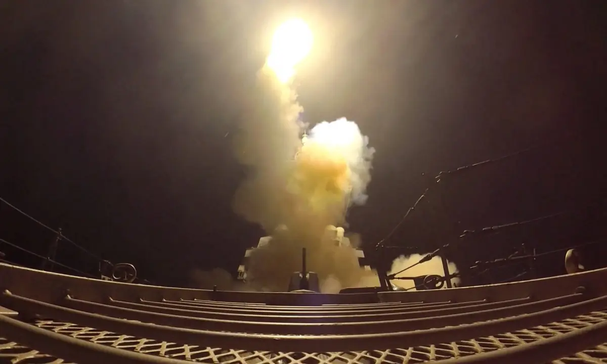US strikes on Iran shown as a projectile launched over the Gulf toward Iranian military targets
