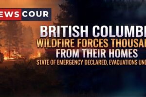British Columbia wildfire response shown by a helicopter dropping water over a smoky forest