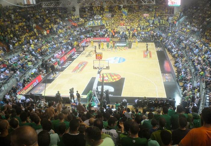 NBA Christmas Day schedule illustrated by a packed basketball arena during a game