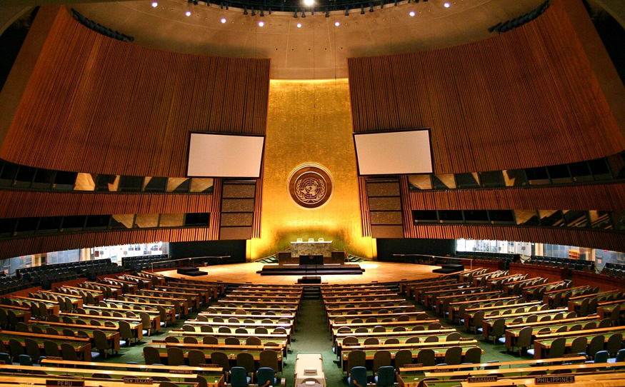 Gaza peace plan diplomacy shown by rows of seats in the United Nations General Assembly hall