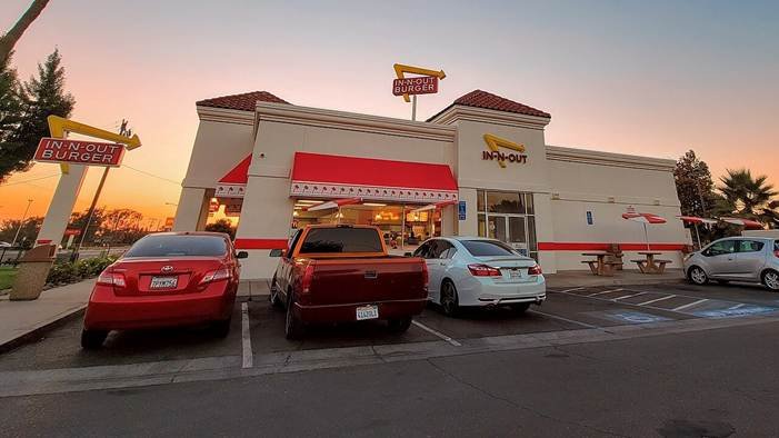 Idaho In-N-Out shooting illustrated by an In-N-Out Burger storefront and parking lot