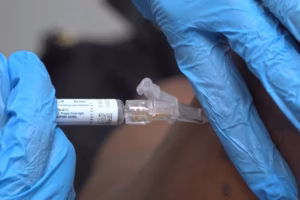 mRNA flu vaccine dose prepared on a table before a seasonal influenza vaccination